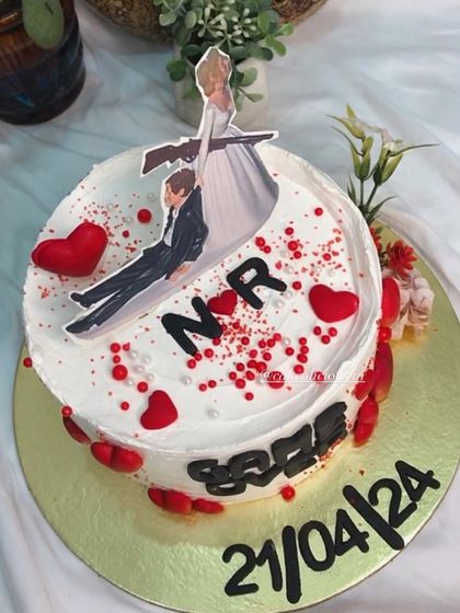 Who says bachelorette cakes can't be elegant and funny? This 'Game Over' cake was so much fun to create, featuring a humorous topper, the wedding date, and red heart details.