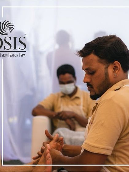 A focused shot of one of our therapists providing a foot massage at an event. We bring the same level of professionalism and care to our on-site services as we do in our spas.