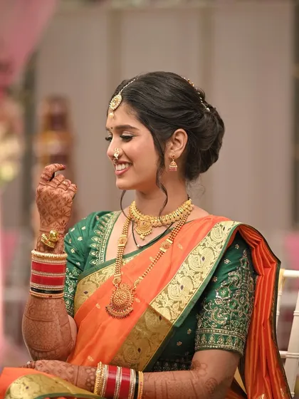 A candid, happy moment. The bride's natural smile and the soft, glowing makeup create a look of timeless elegance.
