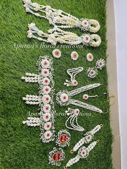 An overhead view of a complete baby shower jewellery set, showing all the matching pieces laid out. This gives a great idea of what a full set includes.