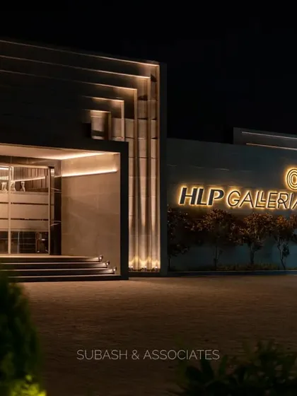 A closer perspective of the HLP Galleria facade at night. The illuminated brand signage and layered architectural elements work together to establish a strong, sophisticated presence.