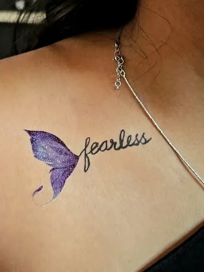 "Fearless" era inspired temporary tattoo. The purple glittery mermaid tail adds a touch of magic and sparkle.