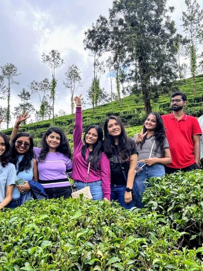 Posing amidst the lush green tea gardens of Wayanad. The scenery here is simply breathtaking.
