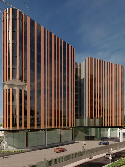A direct frontal view of the solar passive building concept. This angle clearly illustrates the rhythmic pattern of the vertical fins, which are crucial for the building's energy performance.