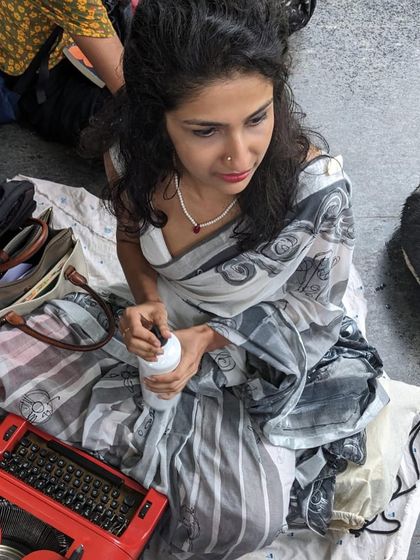 A candid shot from a rainy Saturday at the Cubbon Band Stand. Even when huddled together to stay dry, the warmth of the community and the spirit of creativity shines through.