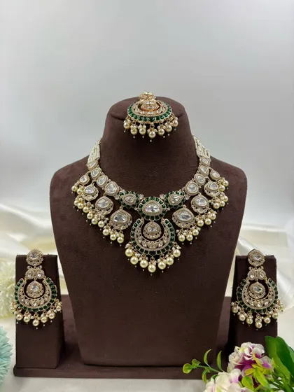 The full crescent-shaped bridal set displayed on a mannequin.