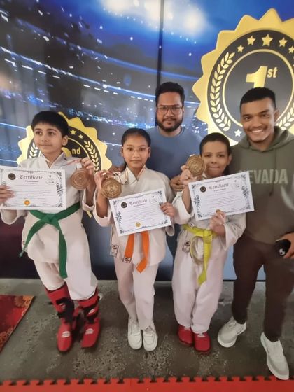 More of our champions with their coaches. We guide them, but they are the ones who put in the work to earn these medals.