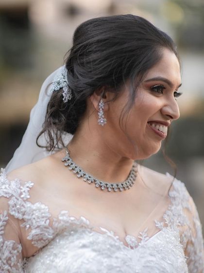 A happy, smiling bride. Our soft glam, natural-looking makeover ensures our brides feel comfortable and confident enough to let their true joy shine through.