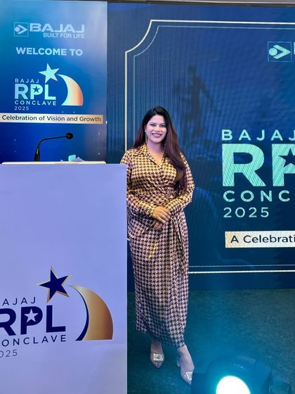 Ready at the podium for the Bajaj RPL Conclave. I ensure I am well-prepared to represent your brand and deliver your message with clarity and professionalism.