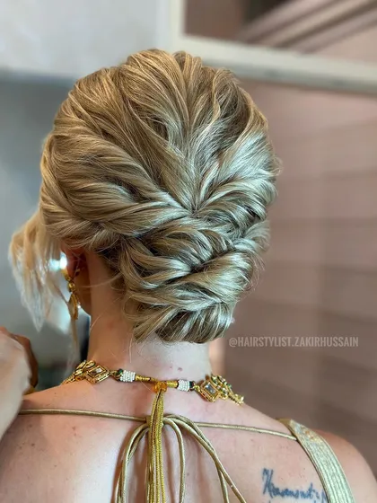 A detailed shot of the blonde updo, emphasizing the texture and dimension in the hair.