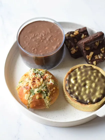 The contents of the Rakhi Delight Box, a perfect mix of sweet and savory treats.