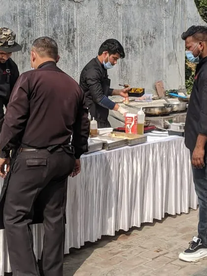 Our team setting up for an outdoor event. We are fully equipped to create a professional kitchen setup anywhere.
