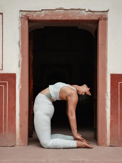 Ustrasana (Camel Pose) in a beautiful archway. This pose is a reminder to let go of what you can't control and open your heart.