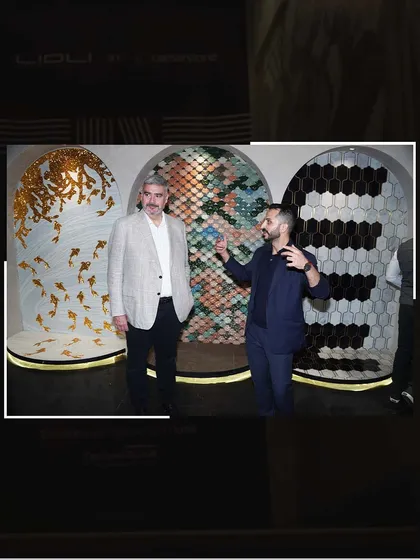 At the Lioli event, explaining our mosaic art panels to an industry leader. It's always inspiring to share our passion for craftsmanship on a global stage.