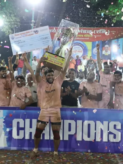 This is the feeling of victory. Our senior team celebrating a major tournament win, holding the championship trophy high amidst a shower of confetti. Hard work and discipline lead to moments like these.
