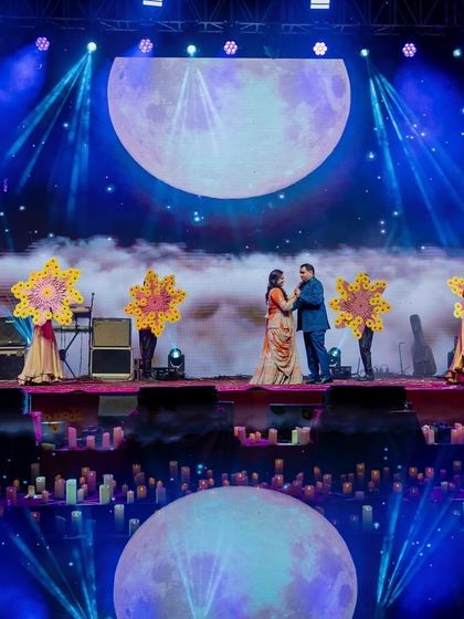 The couple's duet under a giant moon projection, perfectly fitting our 'Chandni Ratein' (moonlit night) theme. The entire stage was designed to create a dreamy, romantic, and celestial ambiance.