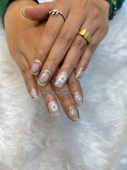 This angle shows the beautiful shine of the gold chrome and the delicate texture of the sculpted flower. It's a very sophisticated and unique look.