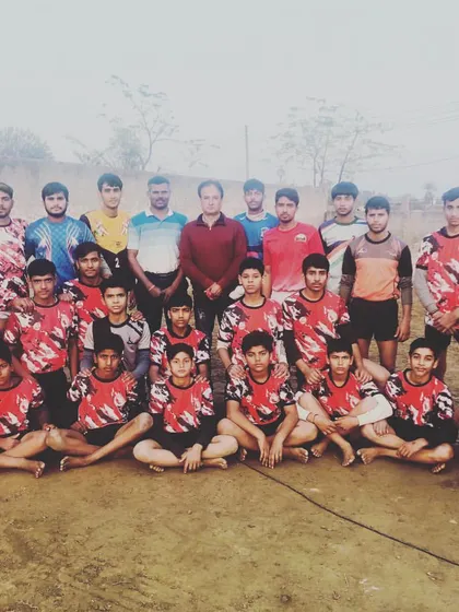 A large group photo with players from different age groups, showing the depth of talent at our academy.