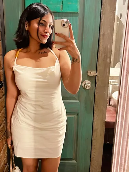 A selfie in a classic little white dress. The ruched fabric and simple straps make it a flattering and timeless piece for any wardrobe.