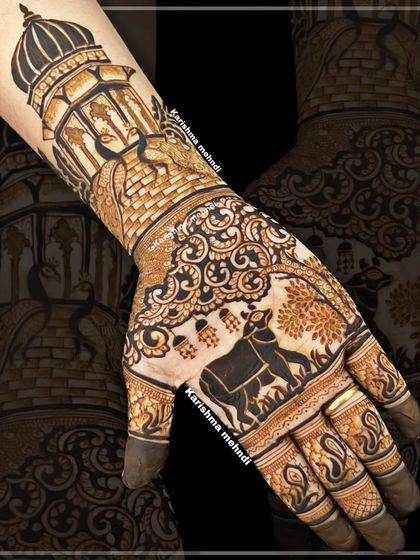A unique design featuring a cow and calf, a symbol of motherhood and nurturing, on the back of the hand. This is framed by a palace jharokha, blending personal symbolism with traditional architectural elements.
