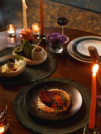 A romantic, candlelit dinner for two, showcasing a specially curated set menu for an unforgettable evening.