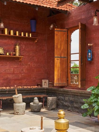 The 'Rau Wada' restaurant in Karad is designed in a traditional style, with an internal courtyard featuring antique grinding stones and brass vessels.