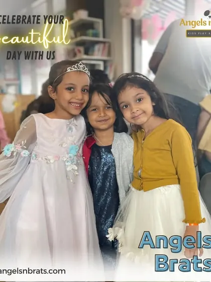 Three adorable little friends posing for a photo during a party. It's so wonderful to see friendships blossom during these fun celebrations.