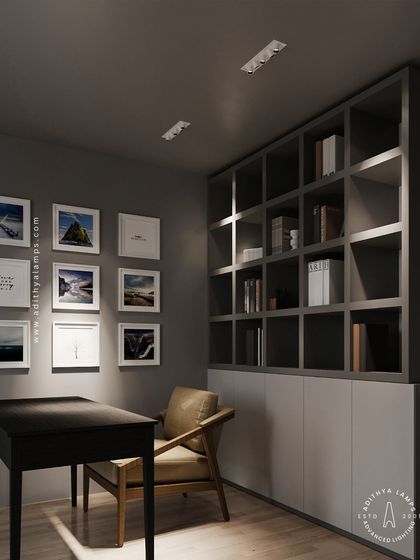 In this home office, our 'Intro' recessed ceiling lights provide excellent task and ambient lighting. They illuminate the gallery wall and the bookshelf without creating distracting glare, ensuring a comfortable and productive work environment.