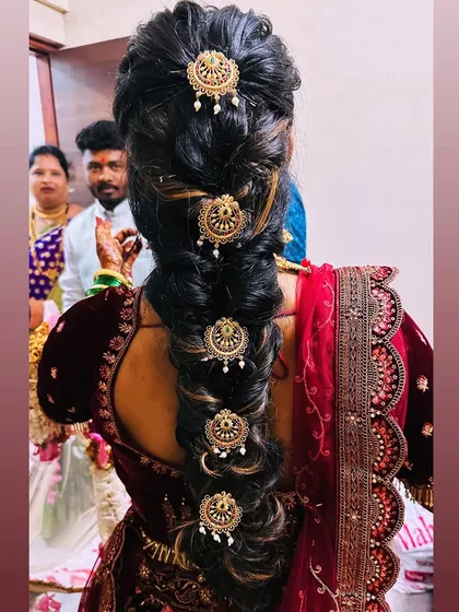 A traditional South Indian bridal braid, decorated with beautiful gold 'jadanagam' ornaments.