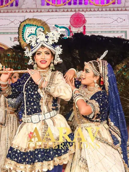 I specialize in bringing cultural stories to life. This Raasleela performance, set against a backdrop of peacock feathers, features dancers in detailed Radha and Krishna costumes, creating a divine and visually stunning experience for everyone.
