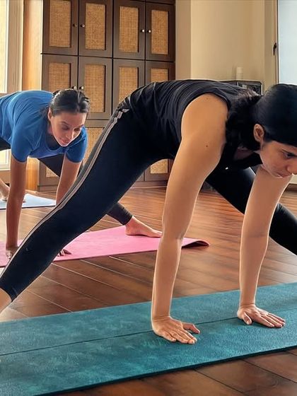 In my classes, we find unity in our diversity. Here, students of all levels explore a wide-legged forward bend, each at their own pace.