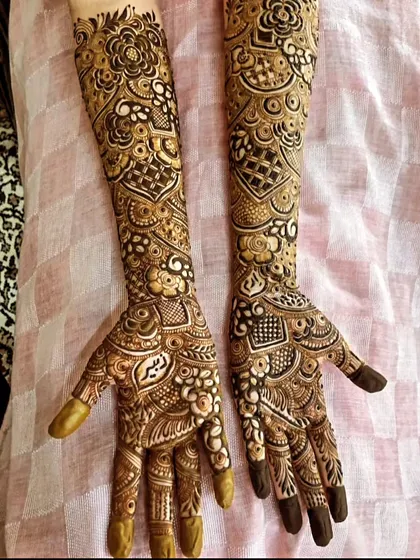A full-coverage, intricate design for a mom-to-be who wanted to go all out. This pattern is packed with details, from fine lines and dots to shaded floral and geometric work.