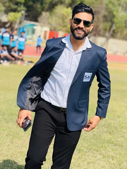A candid moment on the sports ground. Whether I'm coaching or consulting on an injury, my focus is always on bringing out the best in every person I work with.