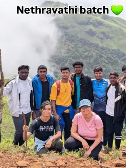 Our Nethravathi batch posing for a photo against the backdrop of misty green hills. This trek is a favorite for its dramatic landscapes.