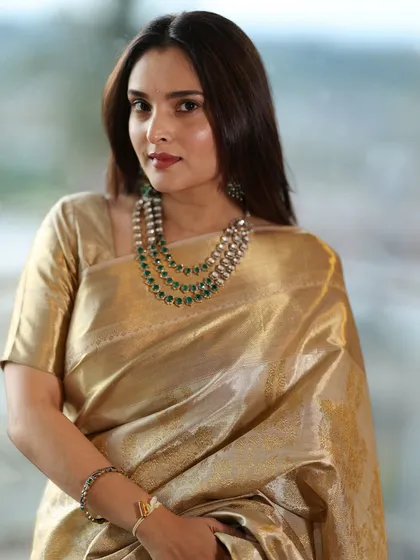 A beautiful portrait of actress and former MP, Divya Spandana (Ramya). I created a classic and elegant look for her with a golden saree and a multi-layered necklace.