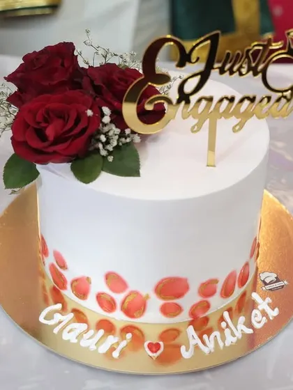 A beautiful photo of the engagement cake for Gauri and Aniket, ready for their special day.