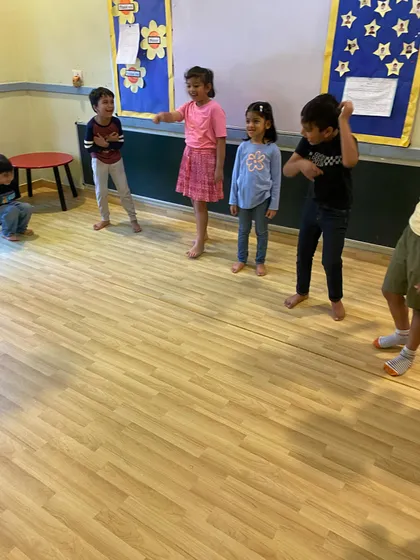 Children engaged in a group activity, learning to work together and express themselves as a team.