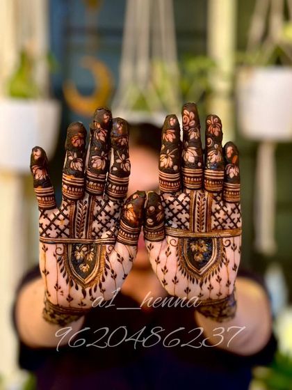 A more intricate design for Karva Chauth, with full palm coverage and detailed finger work.