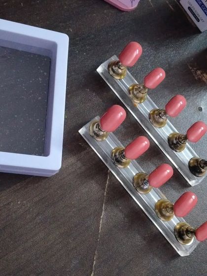 This shows a set of plain, solid-colored nails being prepared for an order. Even my simplest sets are perfectly shaped and finished for a high-quality look.