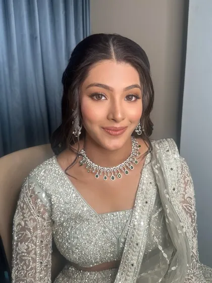 Another angle of this beautiful, soft bridal look. The makeup is designed to look flawless both in person and in photographs, ensuring the bride feels confident all day long.