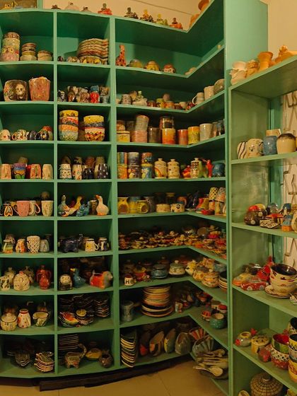 A look at our corner shelves, packed with a wide variety of colorful, hand-painted ceramic mugs and pots created by our talented guests. Each piece tells a unique story.