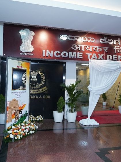 Another view of the decorated entrance, showing the combination of floral arrangements, standees, and drapery. We ensure a cohesive and professional look from the moment guests arrive.