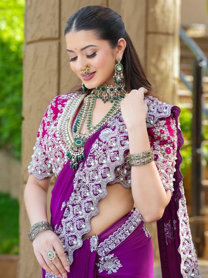 A moment of elegance. The makeup is designed to be timeless, with a soft glow that enhances her features without competing with the intricate details of her look.