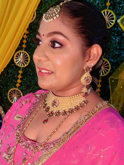 A close up of Tanveer's Lohri makeup. The pink tones on her eyes, cheeks, and lips create a harmonious and radiant look.