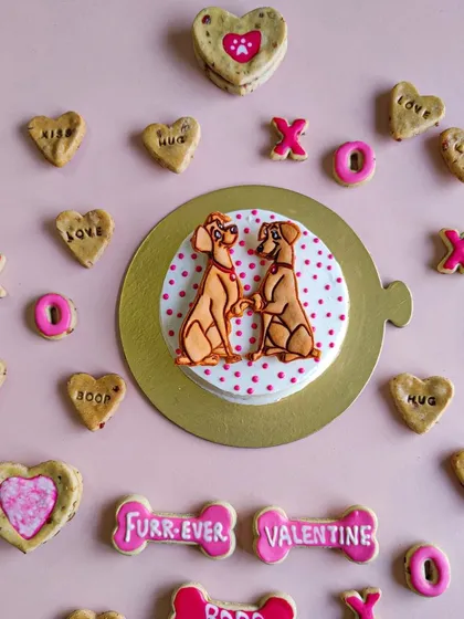 Spreading the love with our Valentine's Day collection. This flat lay shows our "Furr-ever Valentine" cake, heart-shaped cookies, and other romantic treats.