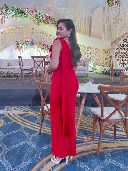 A side view of my one-shoulder red gown, showing the simple yet sophisticated design.