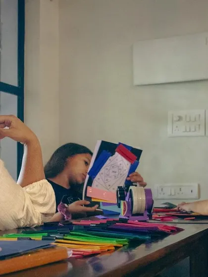 A student admiring her work in progress during our Iris Folding session. This craft is a wonderful way to practice mindfulness and create something beautiful.