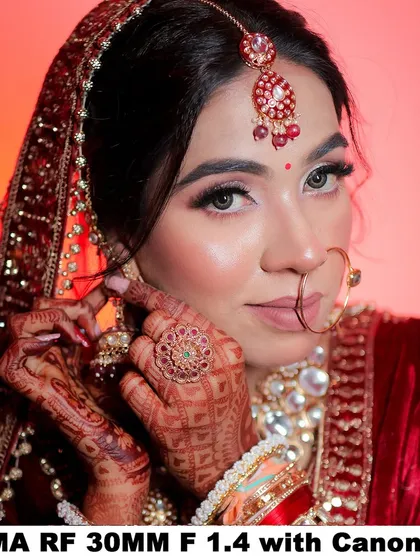 Another example of a detailed shot, focusing on the bride's hands, ring, and earrings.