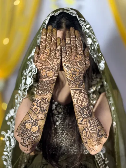 A full frontal view of the bride with her Dubai-style mehendi, highlighting the beautiful symmetry and intricate floral work.