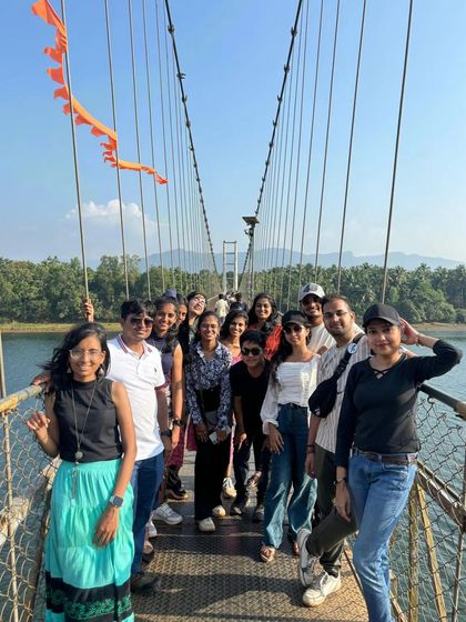 Our group on the suspension bridge, with the orange flag adding a pop of color.
